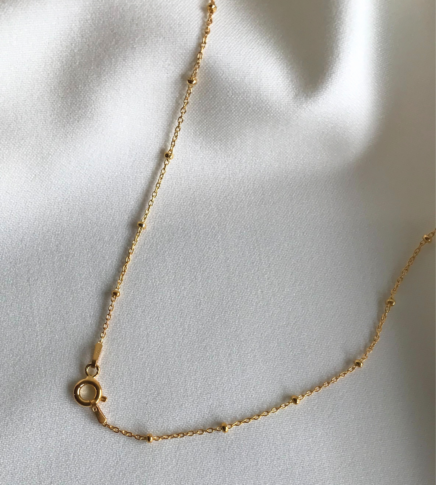 Fio Bolinhas Dourado